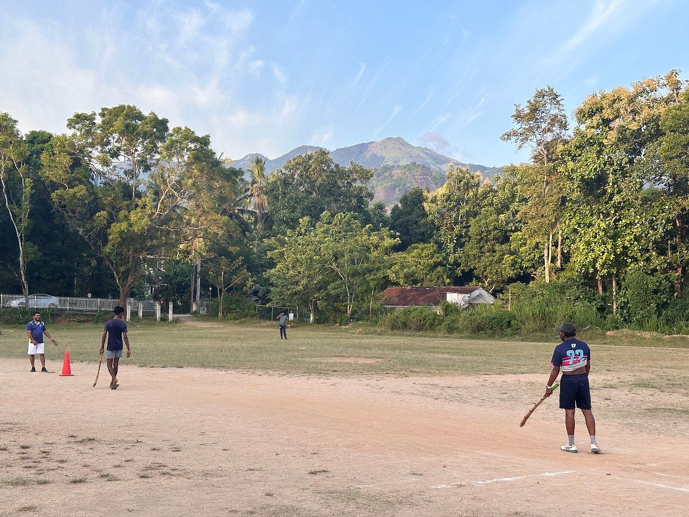 A game of cricket on a village ground
